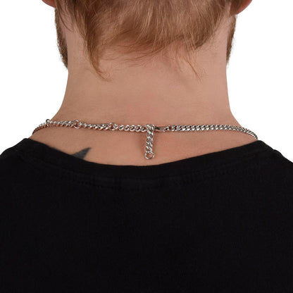 Detailed view of Cuban link chain links showing smooth polished metal finish