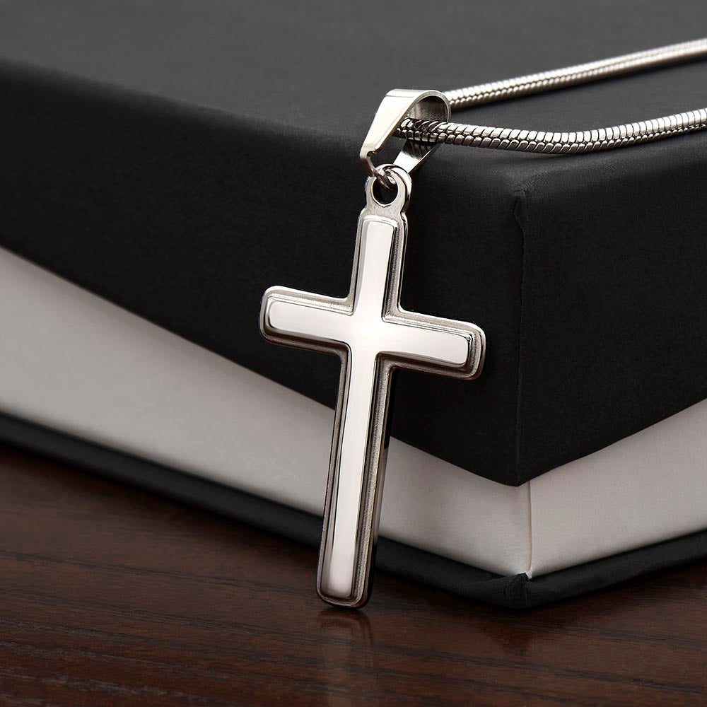 Side angle view of artisan cross pendant highlighting thickness and detail