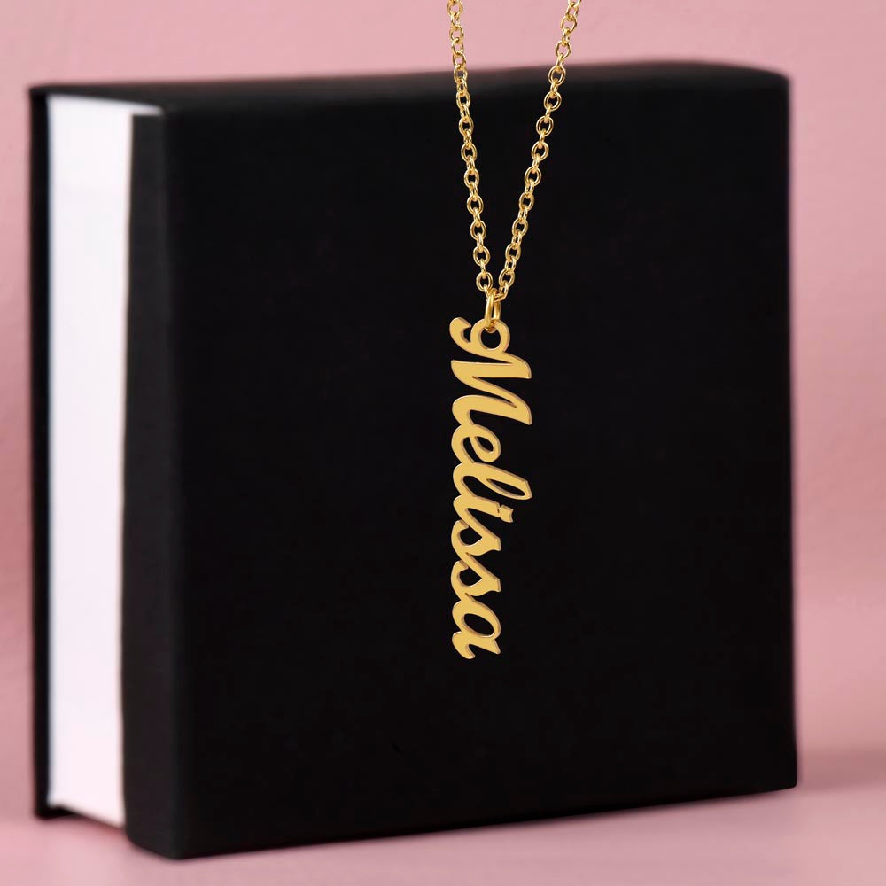 Detailed view of engraved vertical name pendant with custom text