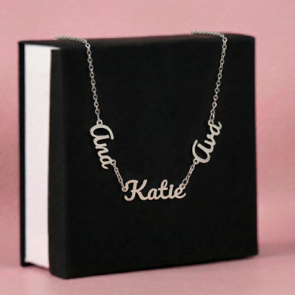Women wearing custom family name necklace featuring multiple engraved names on pendant