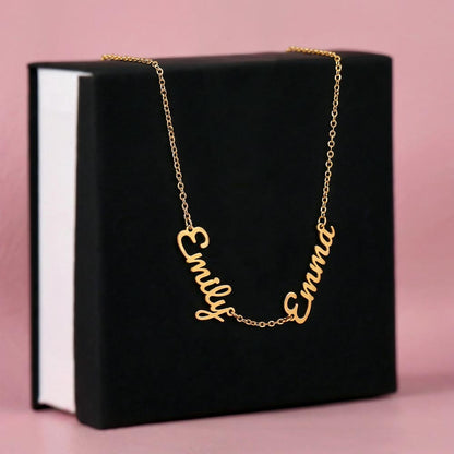Detailed view of engraved custom names on personalized necklace pendant