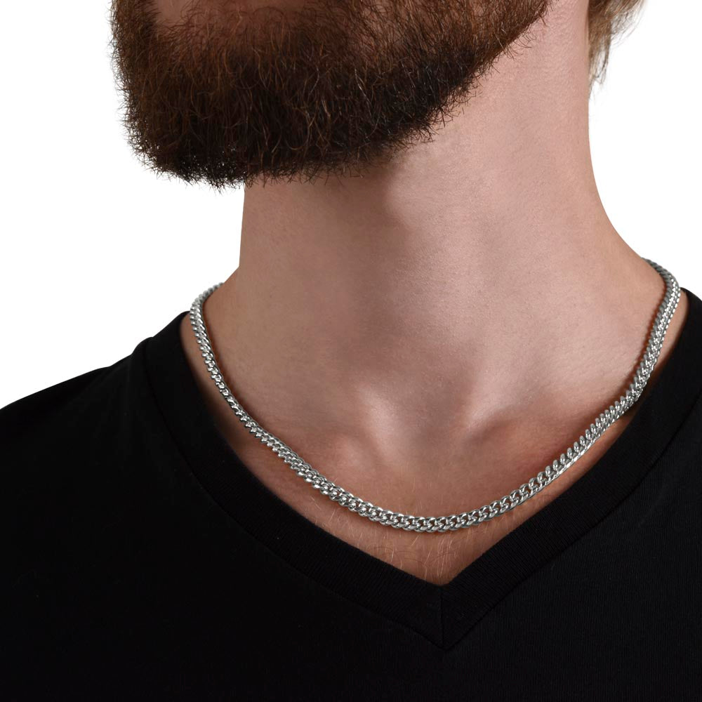 Studio lighting shot of men's Cuban link chain necklace on dark background