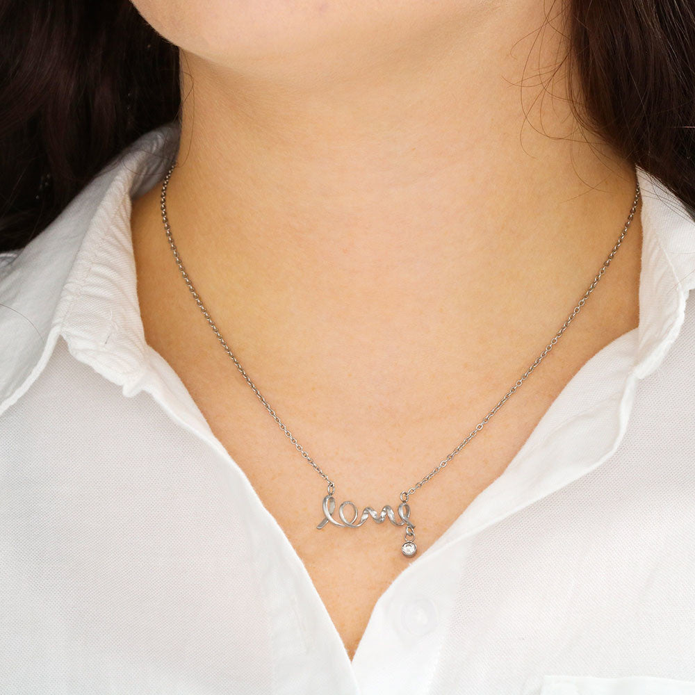 Close-up of scripted love pendant necklace for girlfriend
