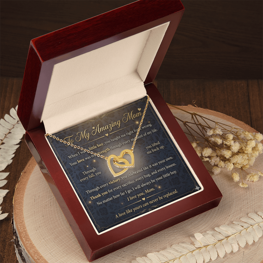 Close detail of gold heart necklace designed for mothers