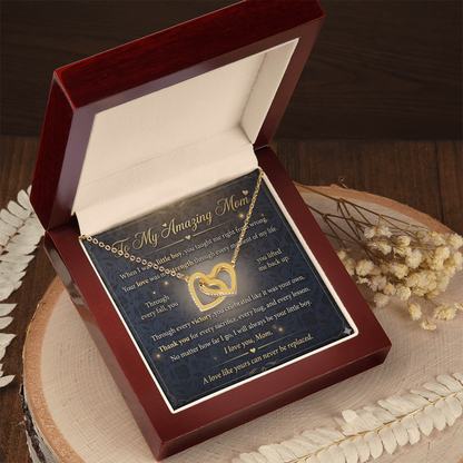 Close detail of gold heart necklace designed for mothers