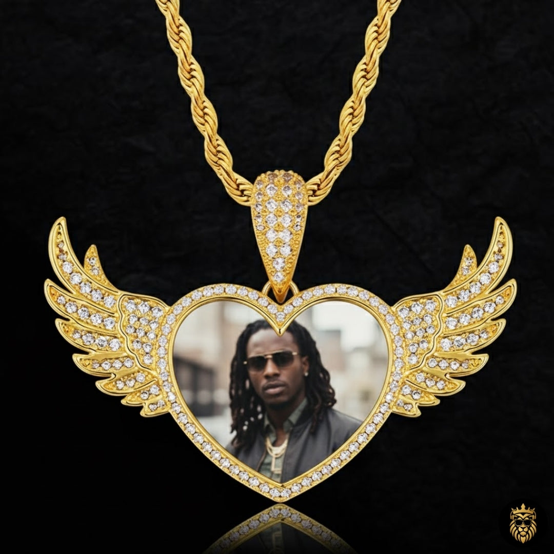Close-up of gold plated angel wings heart pendant jewelry
