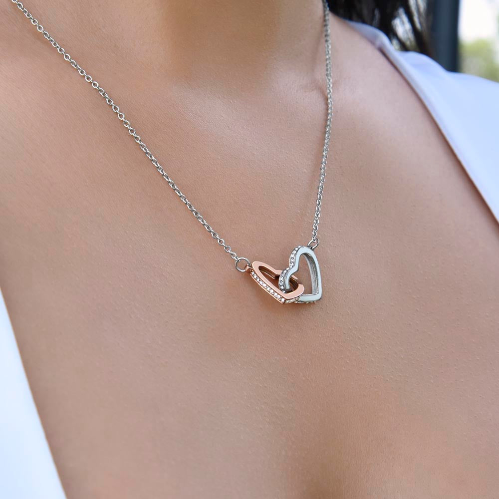 Heart pendant necklace glowing under soft lighting