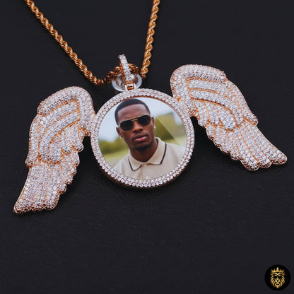 Iced-out moissanite angel wing hip hop pendant shining under light
