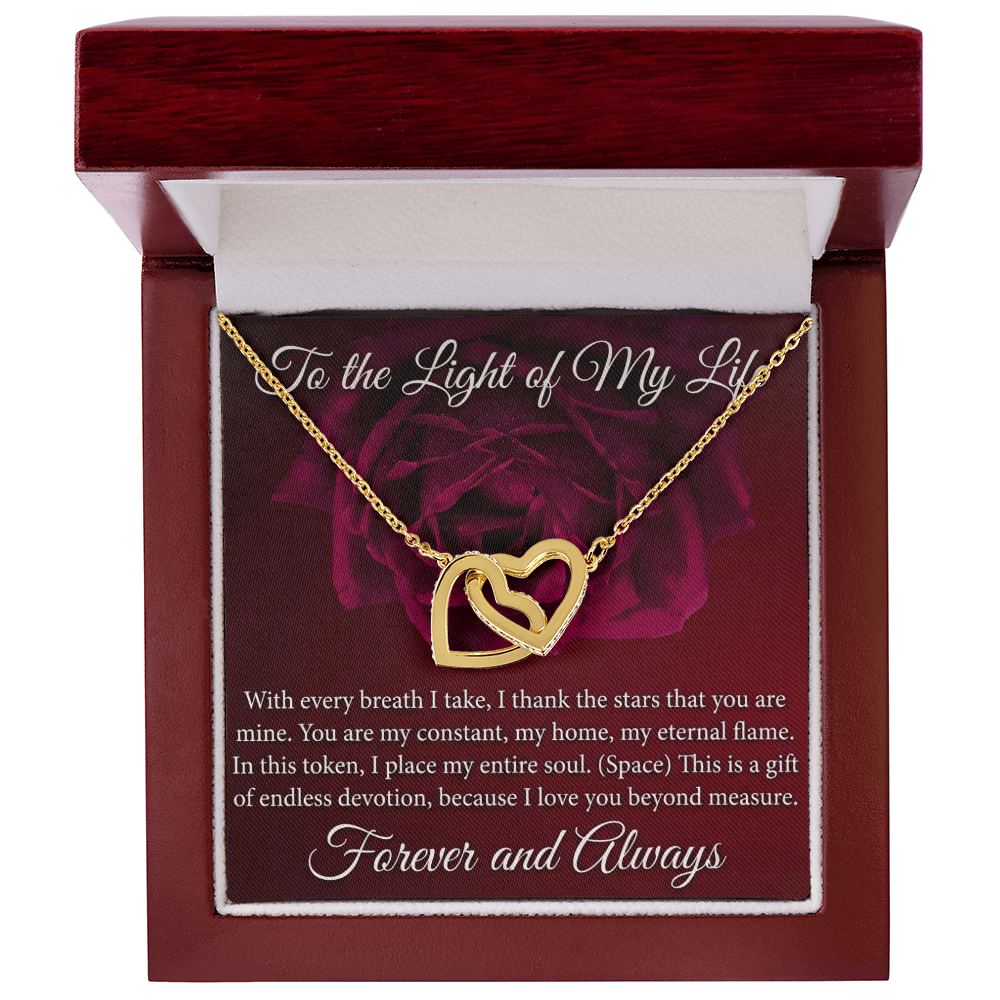 Sparkling interlocking hearts necklace on display