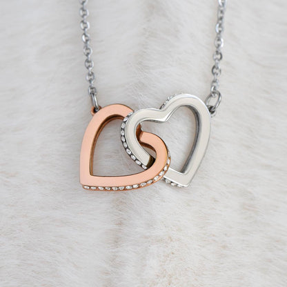 Elegant gift box containing interlocking hearts necklace for mom