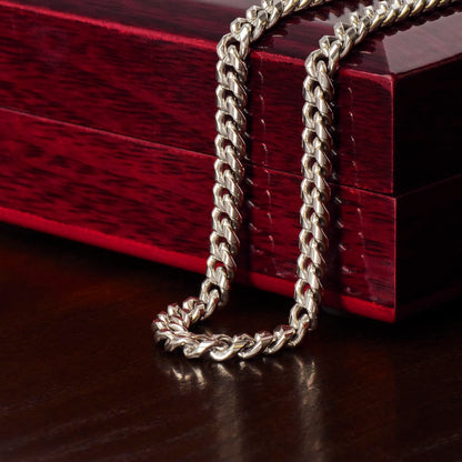 Stylish man wearing Cuban link chain necklace as everyday fashion accessory