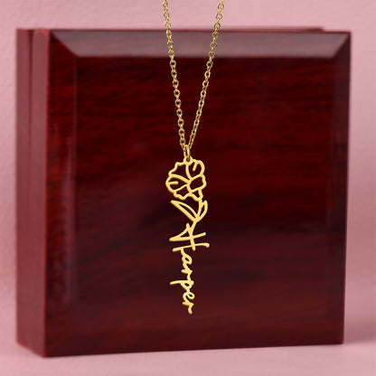 Gold floral name necklace showing custom engraved name with flower style design