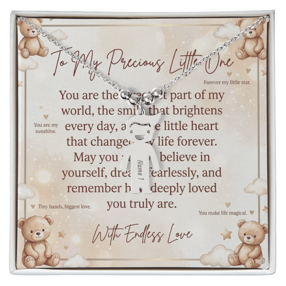 Close-up of personalized engraved kid charm necklace showing detailed charm design