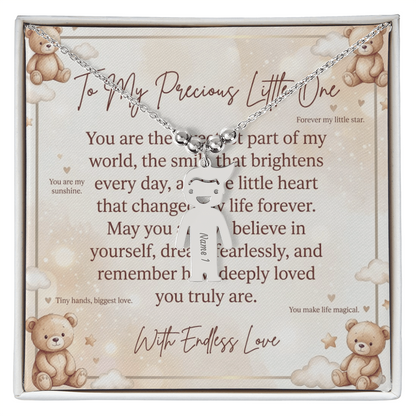 Close-up of personalized engraved kid charm necklace showing detailed charm design