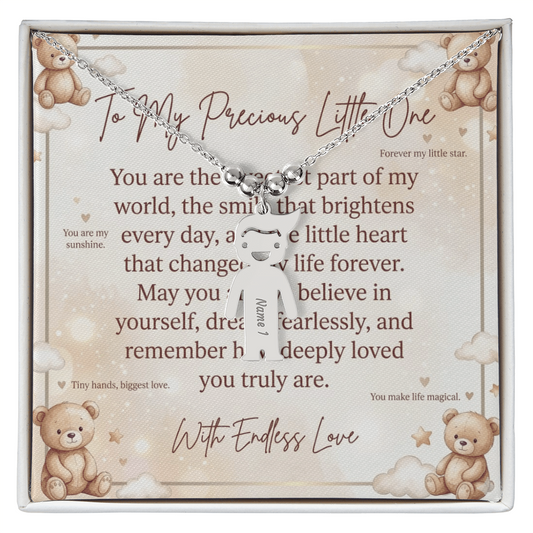 Close-up of personalized engraved kid charm necklace showing detailed charm design
