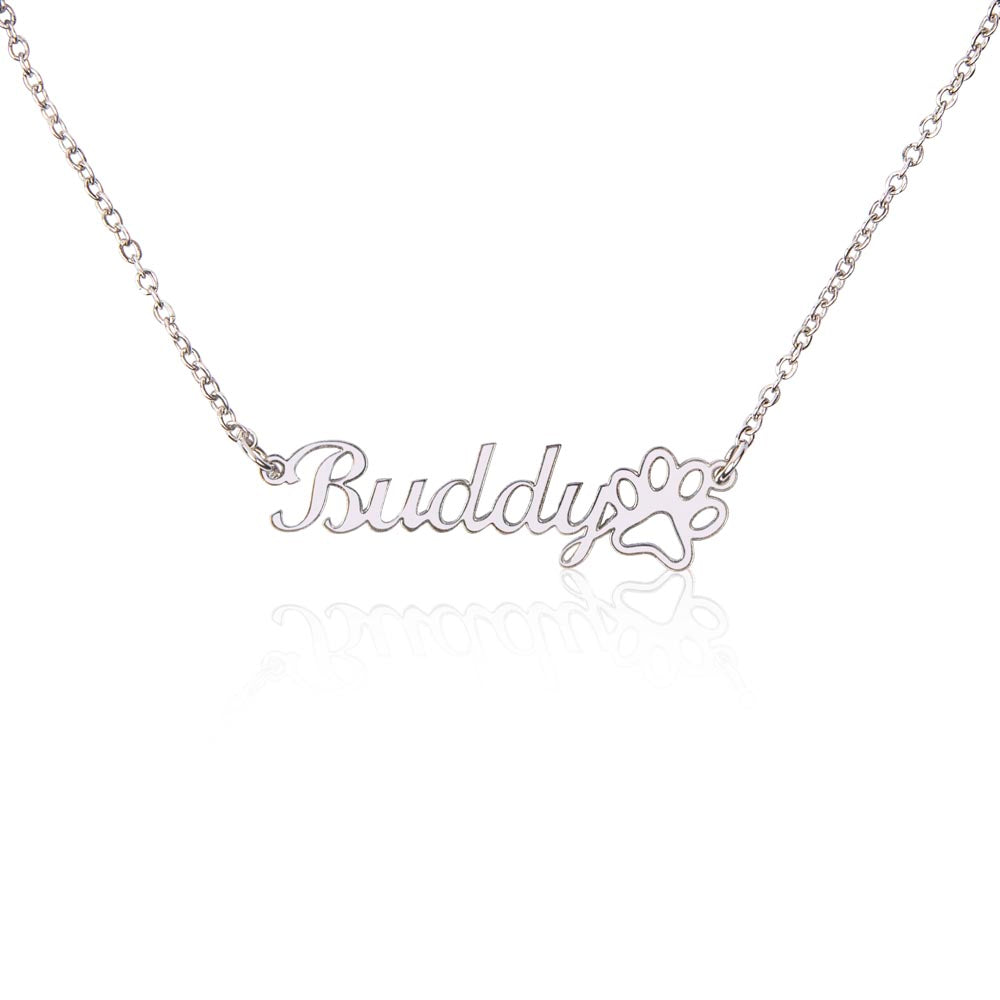 Close-up view of engraved paw print name necklace for pet memorial jewelry