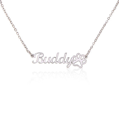Close-up view of engraved paw print name necklace for pet memorial jewelry