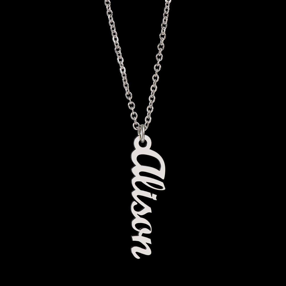 Layered necklace style featuring vertical name pendant