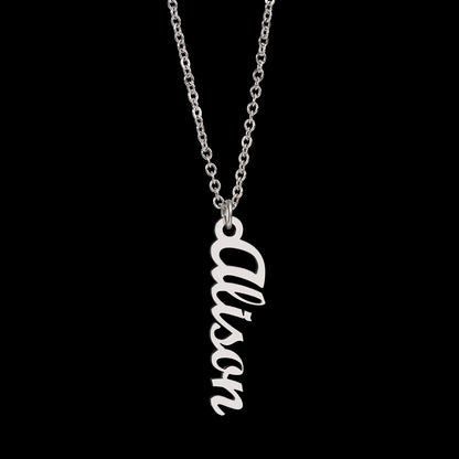 Layered necklace style featuring vertical name pendant