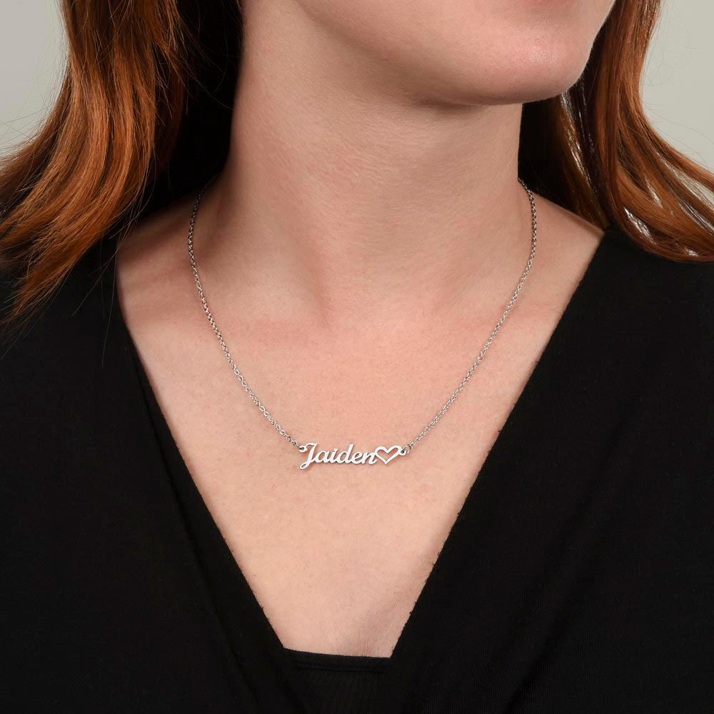 Woman wearing custom heart name necklace elegant jewelry gift