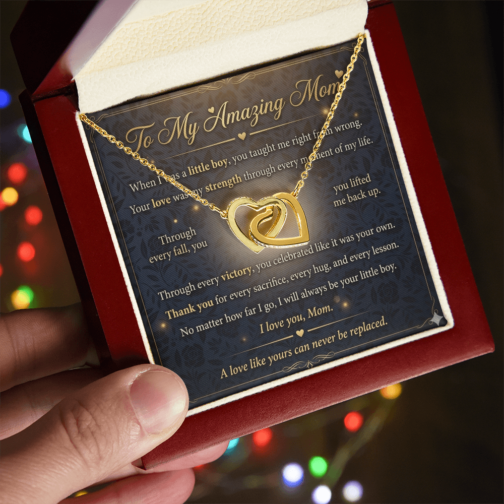 Close-up view of interlocking hearts necklace in gold representing love for mother