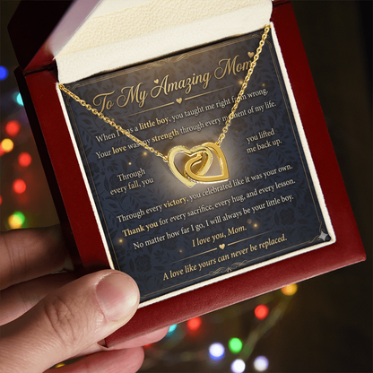 Close-up view of interlocking hearts necklace in gold representing love for mother
