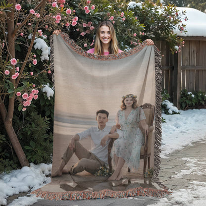 Personalized family photo woven blanket displayed on a living room sofa.