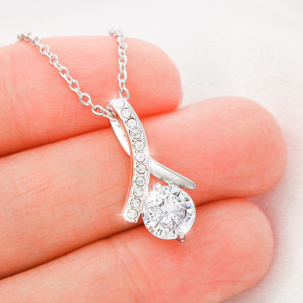 Crystal pendant necklace worn by woman